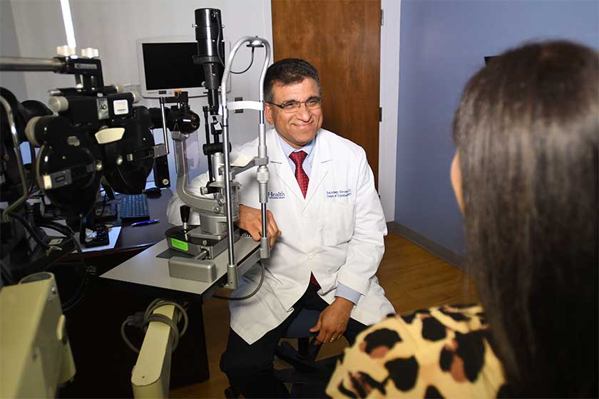 University of Florida faculty ophthalmologist with patient at UF Health Ophthalmology - Jacksonville